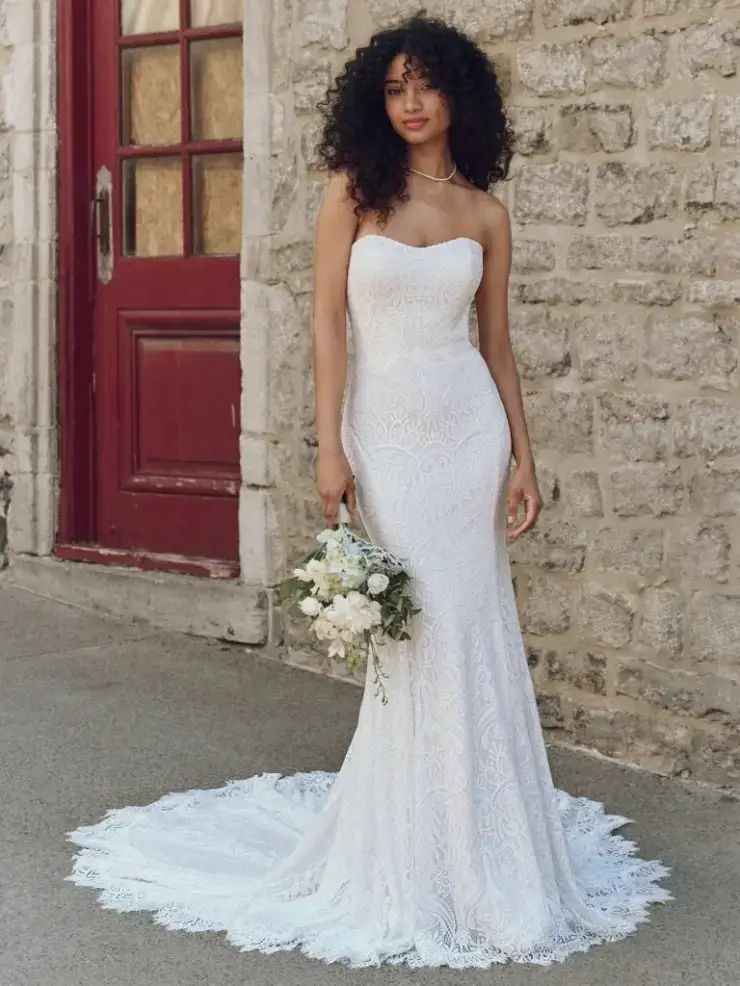 model is wearing a strapless fit and flare bridal gown
