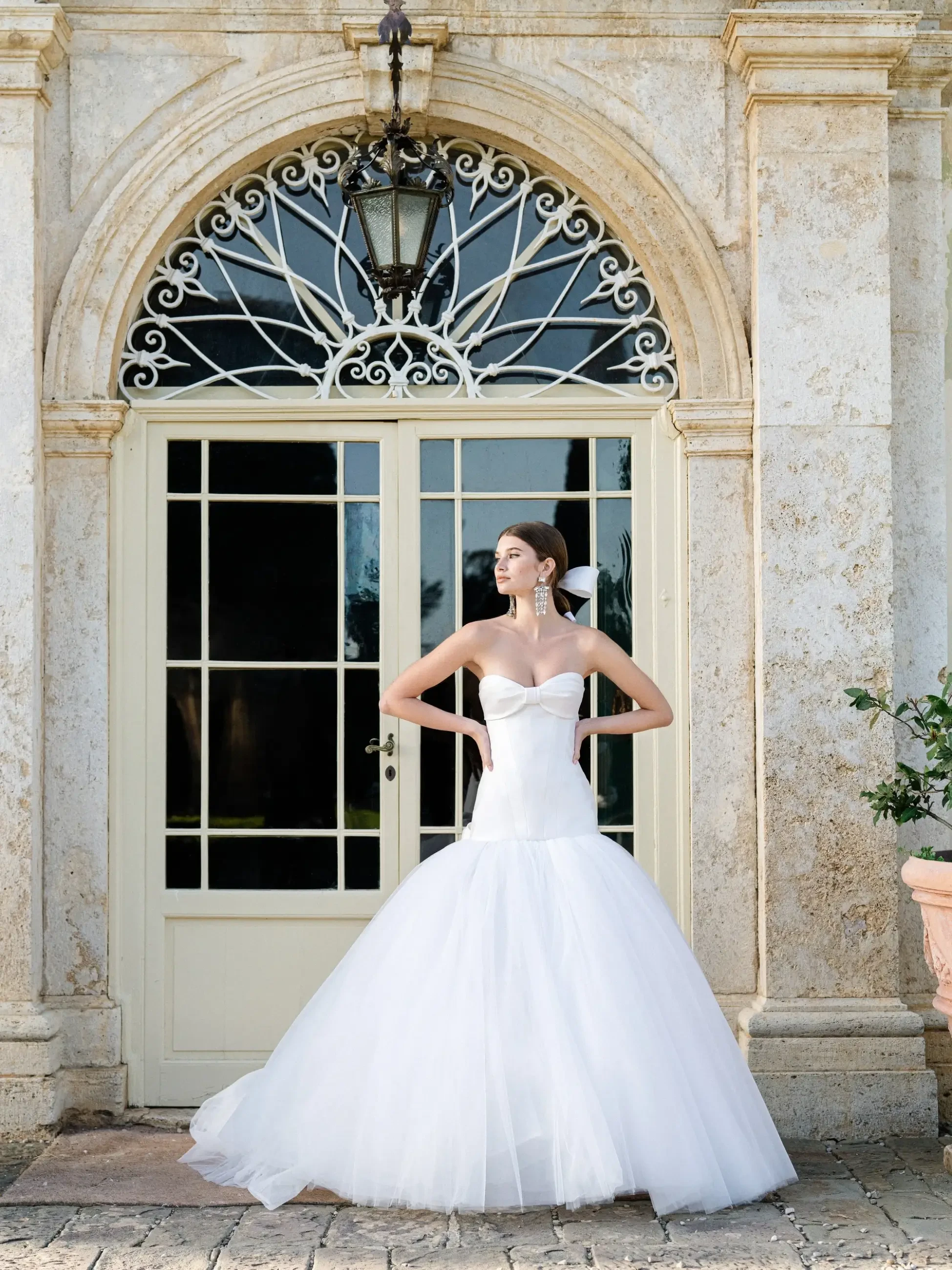 model is wearing a mermaid wedding dress by monique lhullier