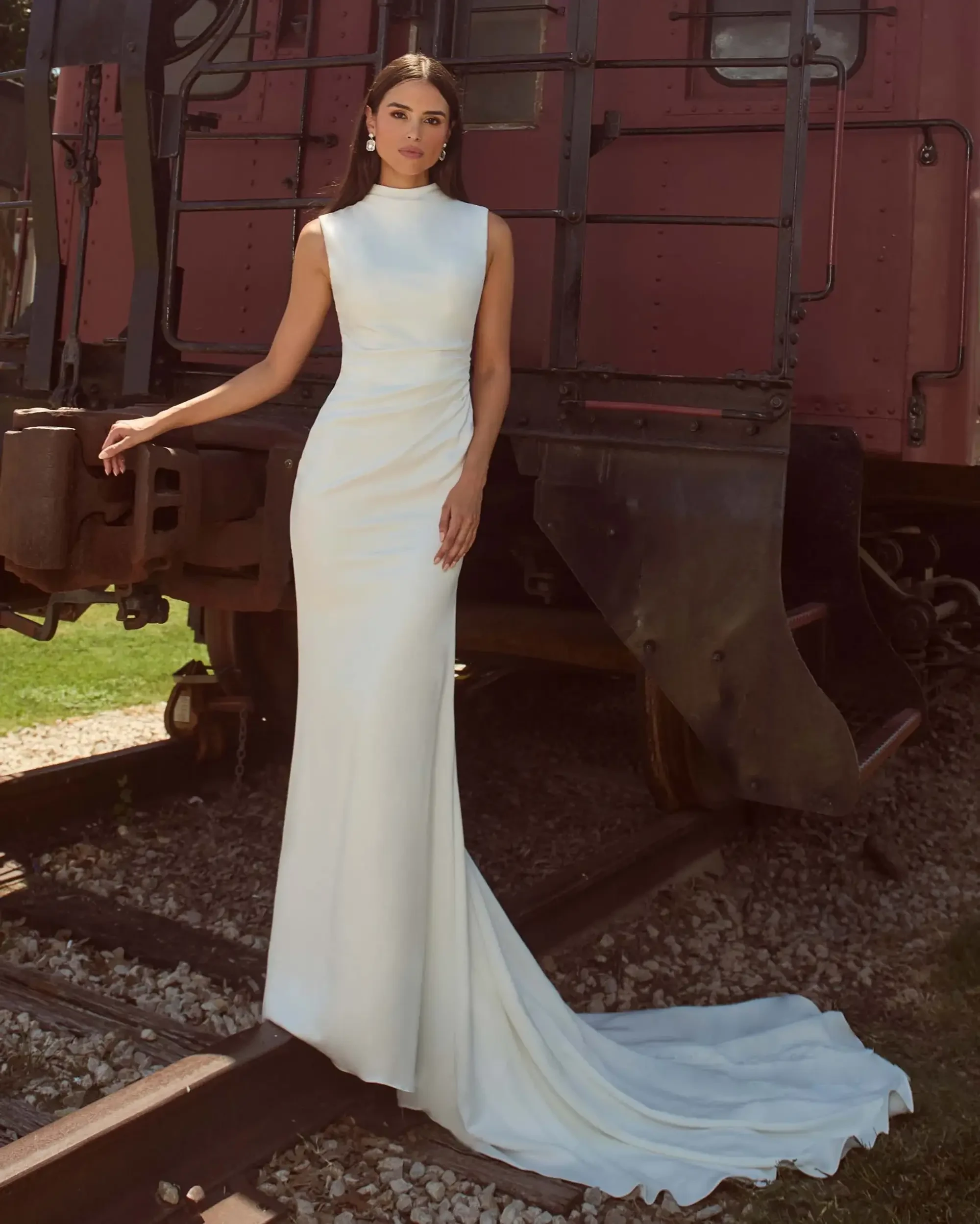 model is wearing a high neckline sheath minimalist wedding dress